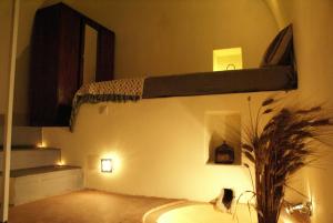 a room with a bunk bed on the wall at Celestia Traditional Houses in Keramoto