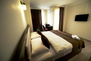 Postel nebo postele na pokoji v ubytování Hotel Aristocrat Batumi