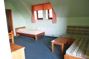 Posteľ alebo postele v izbe v ubytovaní Schneeberg Apartmany