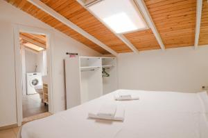 Postel nebo postele na pokoji v ubytování Kasinn Apart Hotel