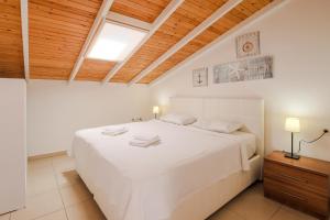 Postel nebo postele na pokoji v ubytování Kasinn Apart Hotel