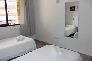 Łóżko lub łóżka w pokoju w obiekcie Apartamento Ronda 4 - Los Boliches
