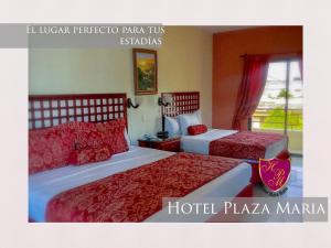 Postel nebo postele na pokoji v ubytování Hotel Plaza Maria