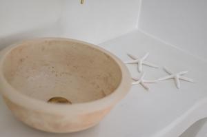 a close up of a bowl with three stars on it at Naxos Hotel Poseidon in Naxos Chora