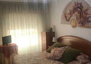 Łóżko lub łóżka w pokoju w obiekcie Mi Casa