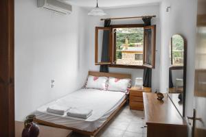 Posteľ alebo postele v izbe v ubytovaní Olive green house