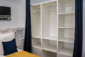 Postel nebo postele na pokoji v ubytování LEs ATELIERS DE LA MADELEINE