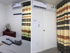 a room with a bed and a closet at at the ALs Place in San Nicolas