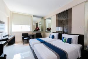 Katil atau katil-katil dalam bilik di Mandarin Hotel Managed by Centre Point