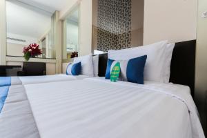 Katil atau katil-katil dalam bilik di Mandarin Hotel Managed by Centre Point