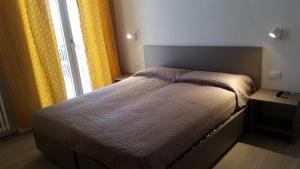 Postel nebo postele na pokoji v ubytování Hotel Stella Polare