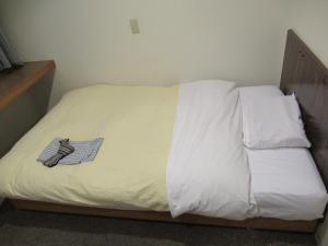 Hotel Crown Hills Kitami Annex客房内的一张或多张床位