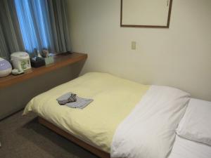 Hotel Crown Hills Kitami Annex客房内的一张或多张床位