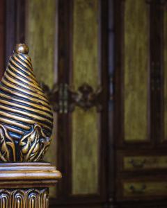 a vase sitting on a table in front of a door at Respect Hotel in Pavlodar
