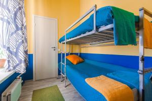 
Двухъярусная кровать или двухъярусные кровати в номере «Петр Мини-Отель»
