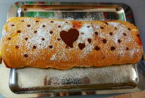 a loaf of bread with two hearts on a pan at Sonnellino in Maremma in Massa Marittima