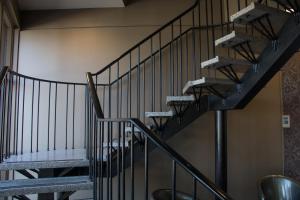 a set of stairs in a building with a staircase at Lockleys Hotel in Adelaide