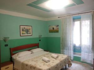 A bed or beds in a room at Roxena house