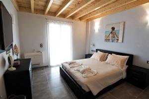 A bed or beds in a room at Villa de la Mer