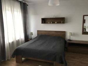 Кровать или кровати в номере Grocka Apartmani & rooms