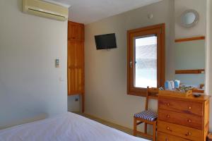 A bed or beds in a room at UzHan Beach Hotel