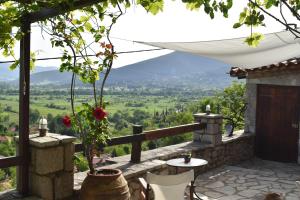 a patio with a view of a valley at Small Stone Maisonette 1 in Lílaia