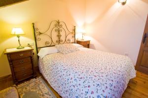 Łóżko lub łóżka w pokoju w obiekcie Vivienda Casa Luisa