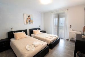 A bed or beds in a room at Villa de la Mer