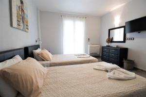 A bed or beds in a room at Villa de la Mer