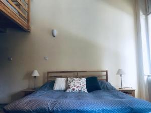 Katil atau katil-katil dalam bilik di Anello Central Apartments