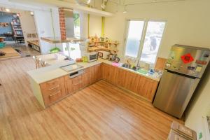 A kitchen or kitchenette at T-Life Hostel