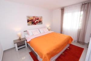 Posteľ alebo postele v izbe v ubytovaní Apartment Sorriso 2