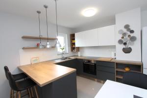 Kuchyňa alebo kuchynka v ubytovaní Apartment Sorriso 2