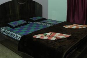 Letto o letti in una camera di Shree Ramkrishna Anandvan