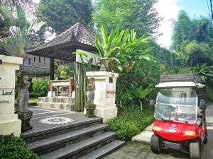 a small red scooter parked in front of a building at Villa with private pool at Villa Nirvana Ubud in Ubud
