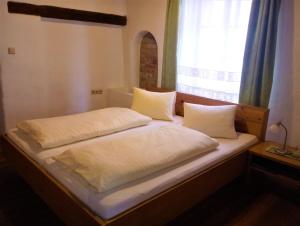 Postel nebo postele na pokoji v ubytování Hotel Eisenhuthaus