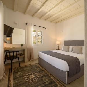 Postel nebo postele na pokoji v ubytování Cova Mykonos Suites