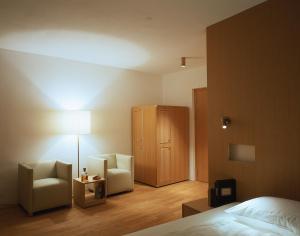 Ένα ή περισσότερα κρεβάτια σε δωμάτιο στο Hotel Gasthof Grüner Baum