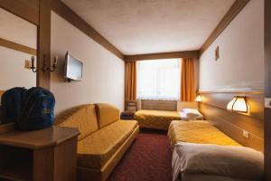Postel nebo postele na pokoji v ubytování Hotel Catinaccio