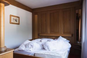 Postel nebo postele na pokoji v ubytování Hotel Catinaccio