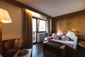 Postel nebo postele na pokoji v ubytování Hotel Catinaccio