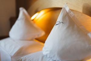 Postel nebo postele na pokoji v ubytování Hotel Catinaccio