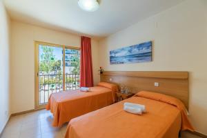 Posteľ alebo postele v izbe v ubytovaní Rentalmar Pins Marina