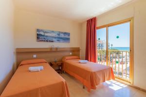 Posteľ alebo postele v izbe v ubytovaní Rentalmar Pins Marina