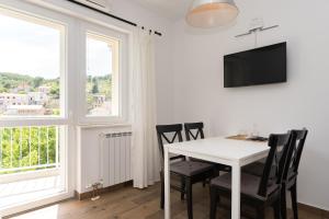 TV a/nebo společenská místnost v ubytování Apartments Ivan Zaton