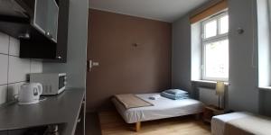 Postel nebo postele na pokoji v ubytování 999 Aparthostel