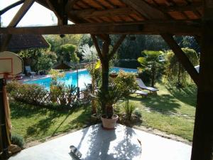 a view of a backyard with a swimming pool at Chambres d'Hôtes de Pesquès in Termes-dʼArmagnac