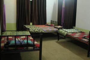 Letto o letti in una camera di Shree Ramkrishna Anandvan