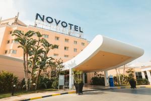 a novation hotel in front of a building at Novotel Cairo 6th Of October in 6th Of October