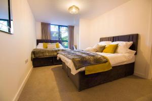 Ένα ή περισσότερα κρεβάτια σε δωμάτιο στο Open Key Apartments